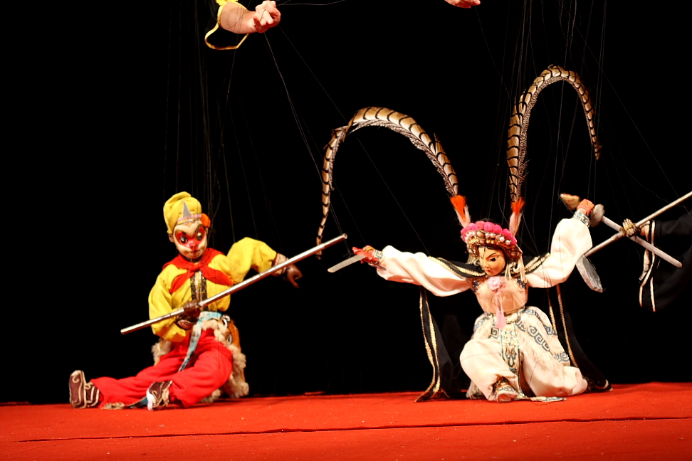 Quanzhou Puppet Troupe performers operating marionettes