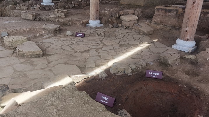Excavated furnace, slag outlet and working floor at the Xiacaopu iron site
