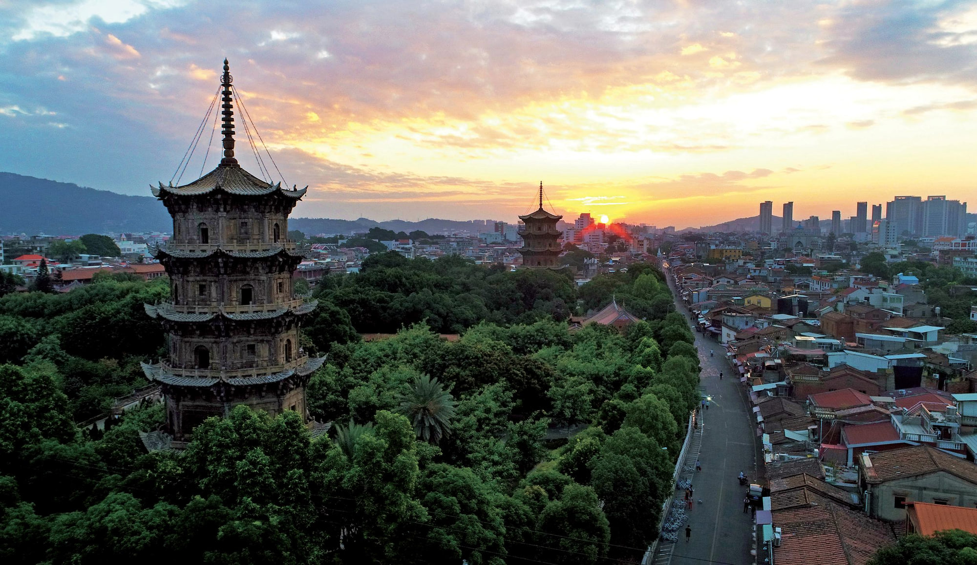 Kaiyuan Temple's twin pagodas and Quanzhou historic city at sunset
